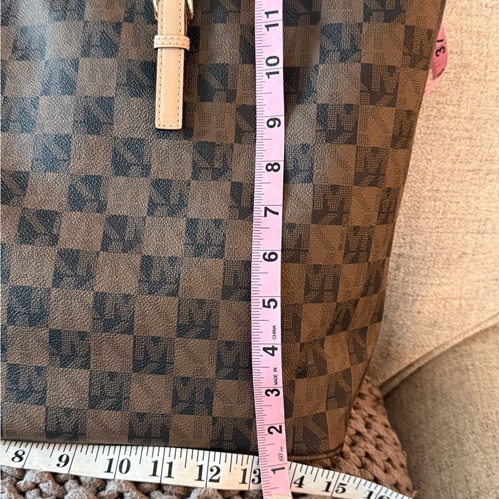 MICHAEL Michael Kors Jet Set travel tote in a brown checkered monogram pattern. - Picture 7 of 10